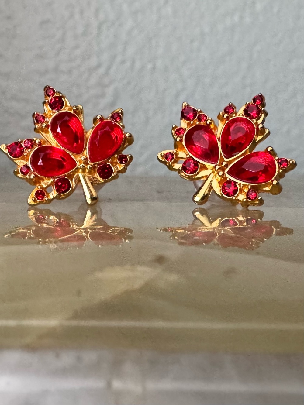 Gold-Tone Red Crystal Maple Leaf Stud Earrings 1/2”